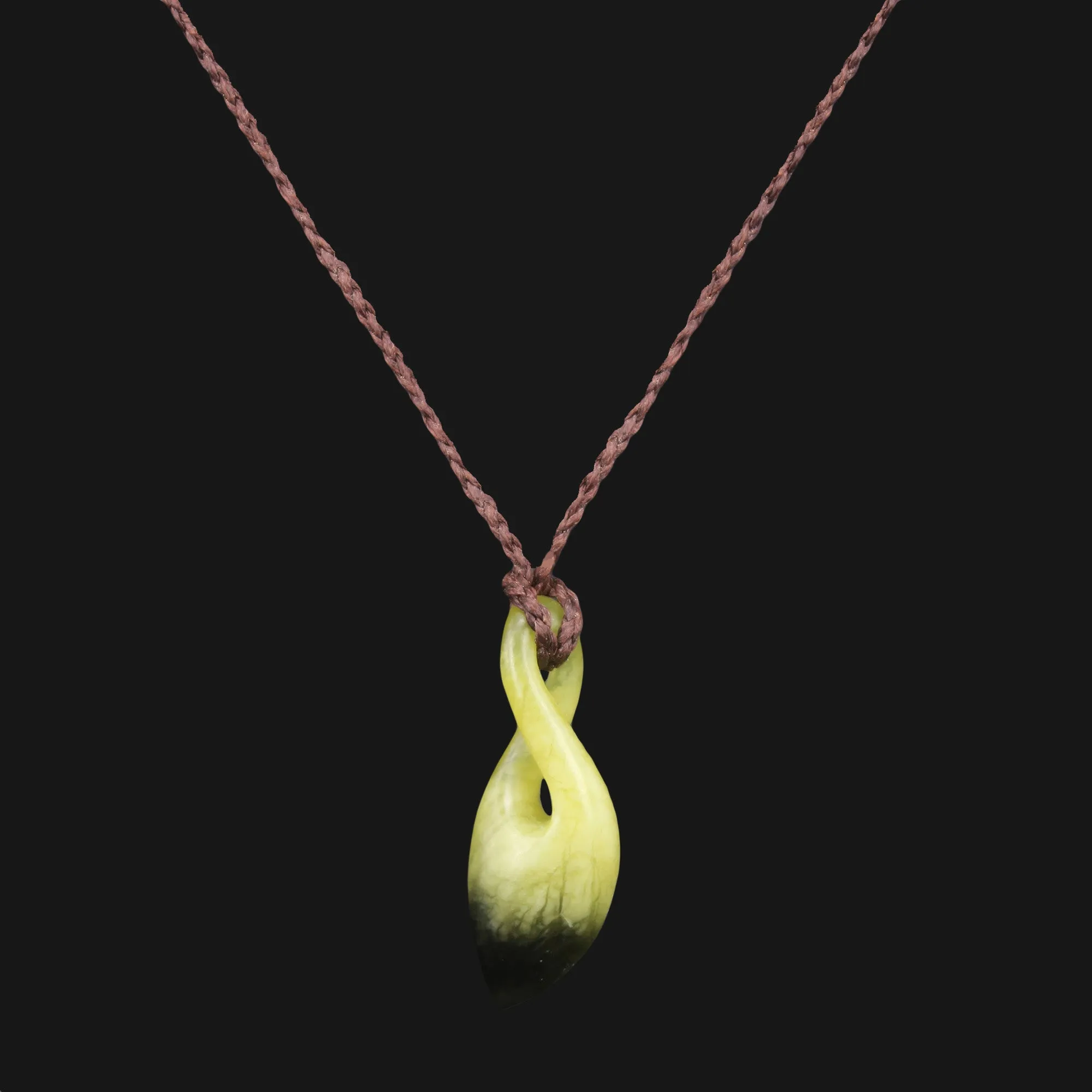 Zen-inspired Hand Carved Green Flower Jade Pendant - Simple Twist Design for Everyday Style and Outdoor Adventures. Timeless Elegance